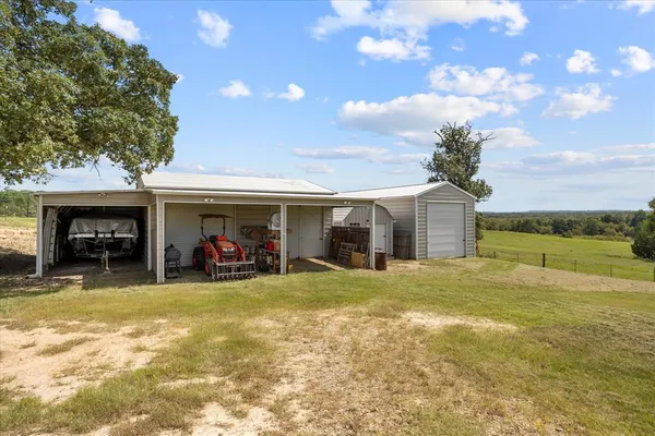 a view of a yard with a tree