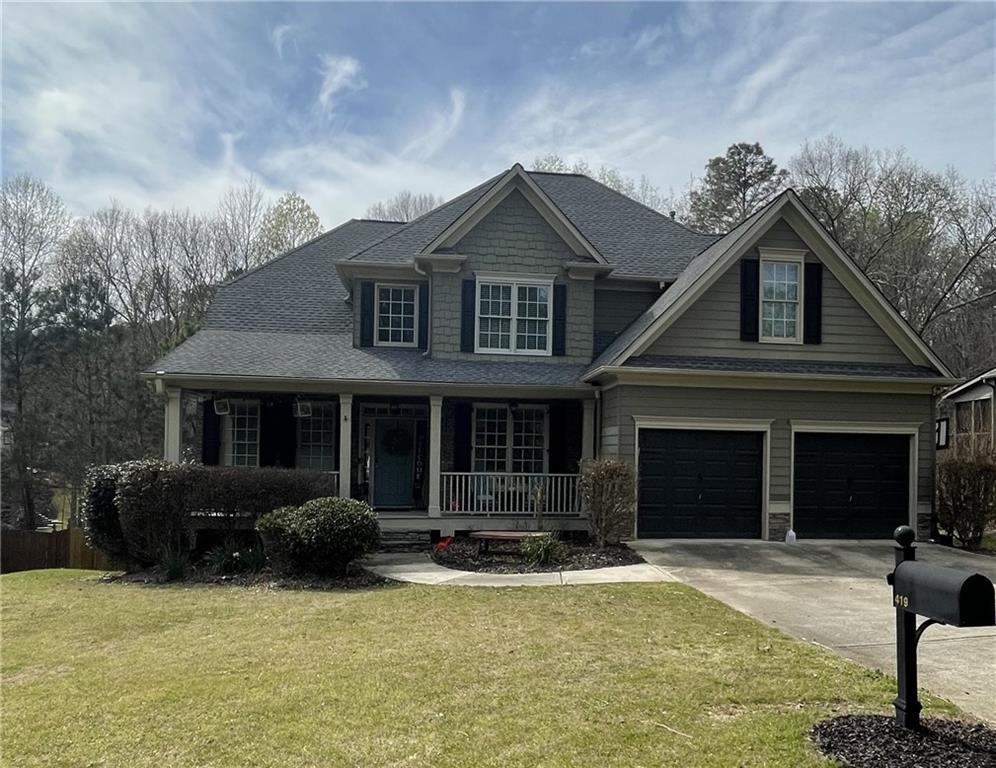419 Gold Crossing Canton, GA 30114 - Photo 1 of 1 a front view of a house with garden