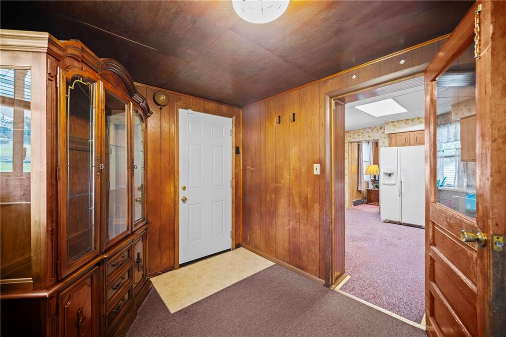18 Locust Street Clarksville, PA 15322 - Photo 14 of 38 This is a 2nd entrance into the home. Laundray area is on the opposite side of the room, just behind the open door to the kitchen