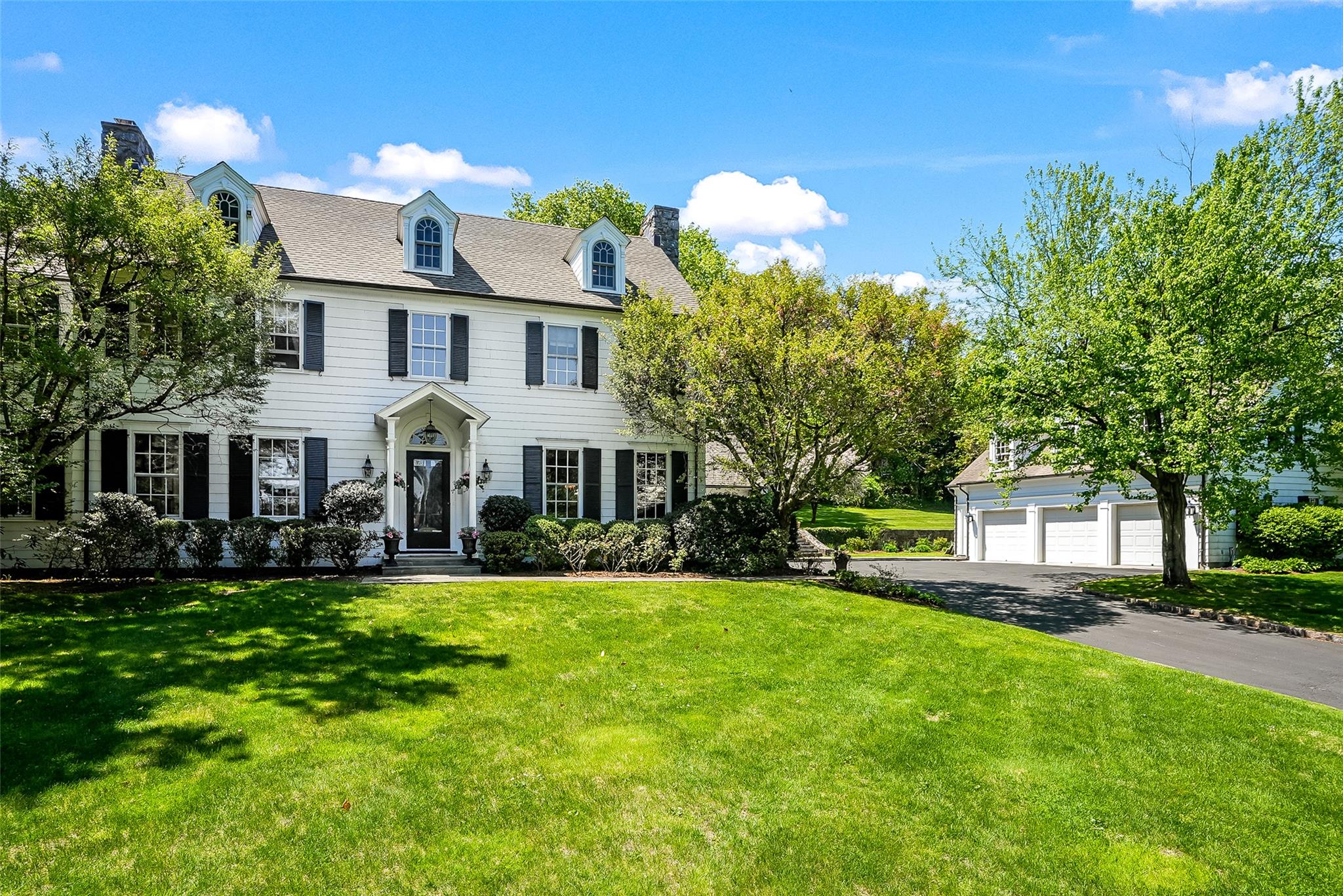 Through the gated entrance, incredible curb appeal at 472 Purchase Street,
