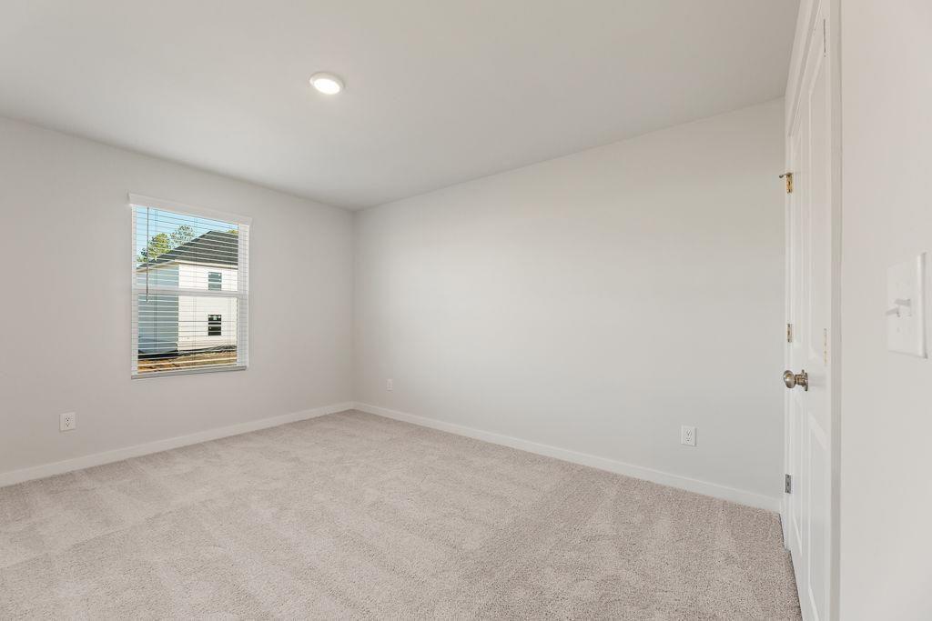 542 Arborston Way Jefferson, GA 30549 - Photo 17 of 28 an empty room with a window