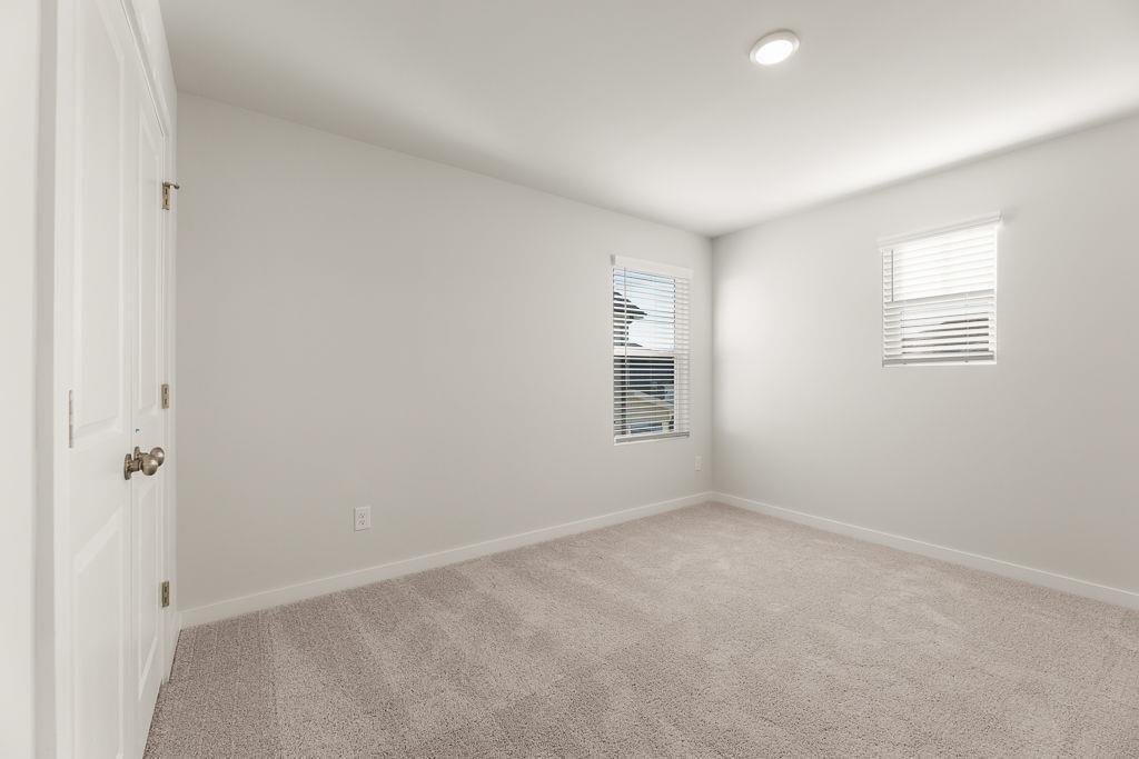 542 Arborston Way Jefferson, GA 30549 - Photo 18 of 28 an empty room with windows