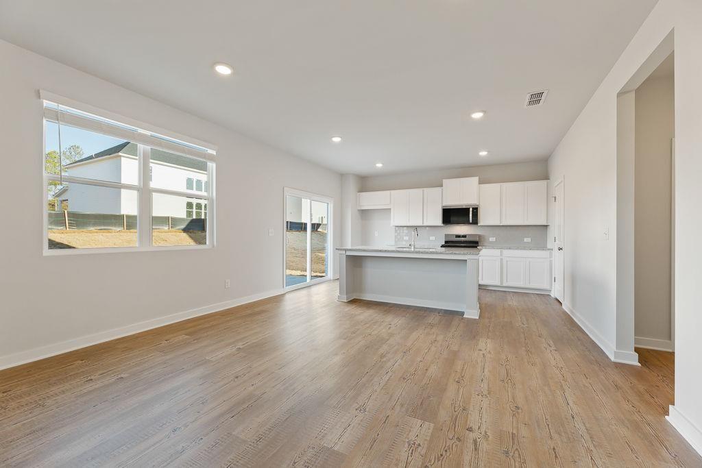 542 Arborston Way Jefferson, GA 30549 - Photo 24 of 28 a view of kitchen with wooden floor