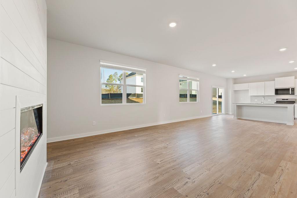 542 Arborston Way Jefferson, GA 30549 - Photo 27 of 28 a view of an empty room with a window and fireplace