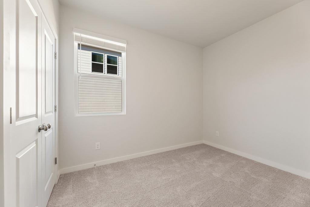 542 Arborston Way Jefferson, GA 30549 - Photo 6 of 28 an empty room with a window