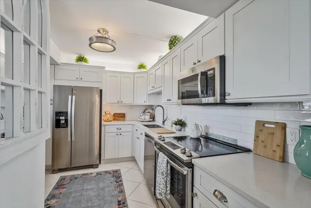 a bedroom with bed and window