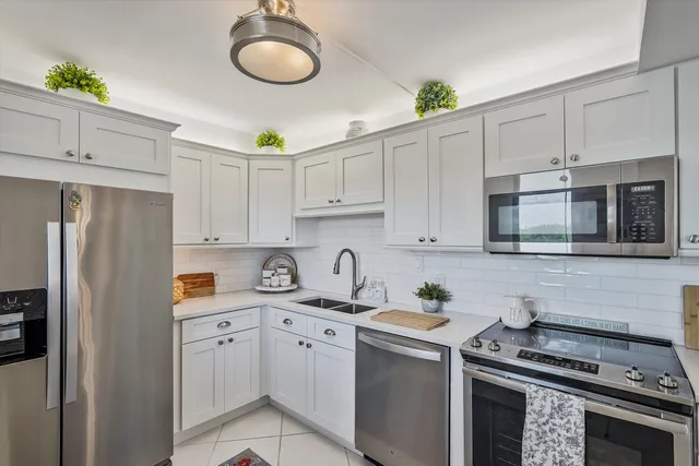 a bedroom with a bed and a dresser next to a window