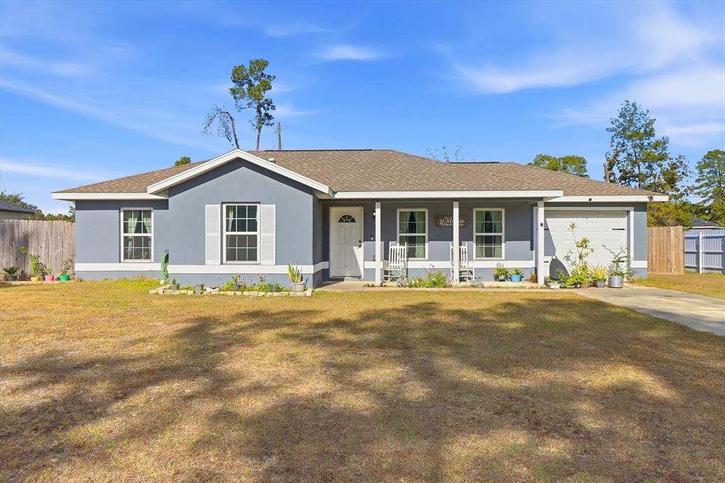 3683 169th Place Ocala, FL 34473 - Photo 1 of 1 a front view of a house with a garden