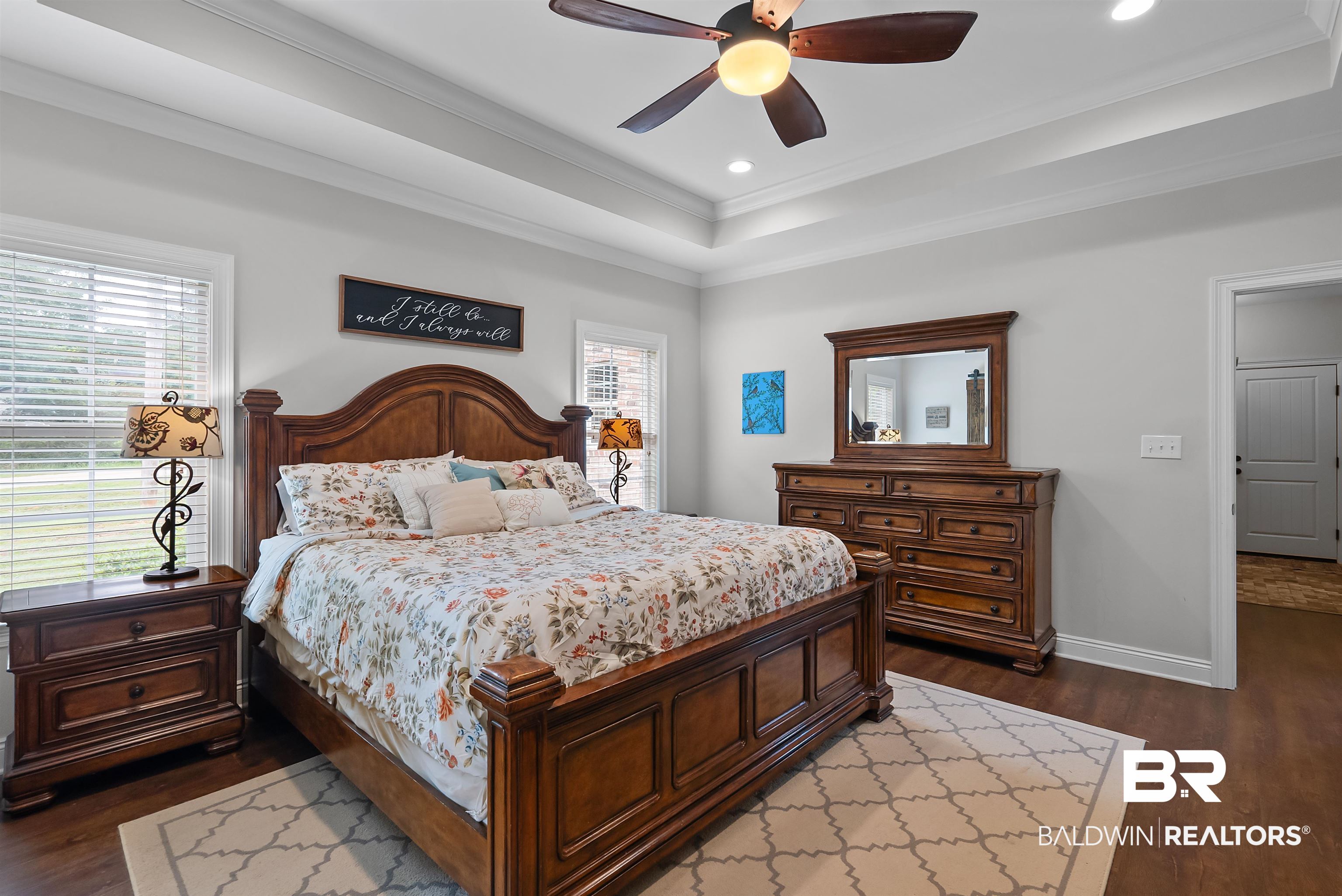12070 Comalander Road Fairhope, AL 36532 - Photo 19 of 50 Bedroom featuring rich wood-finish flooring and light gray walls