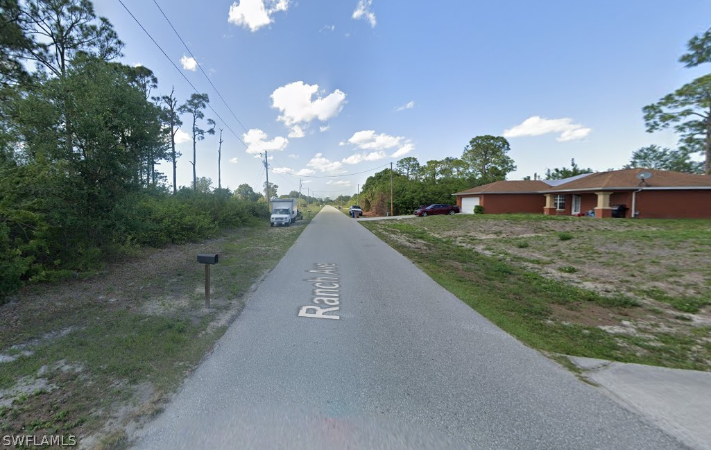350 Ranch Avenue Lehigh Acres, FL 33974 - Photo 3 of 5 a view of a house with a yard