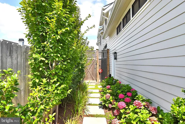 a bedroom with a bed couch and a large window