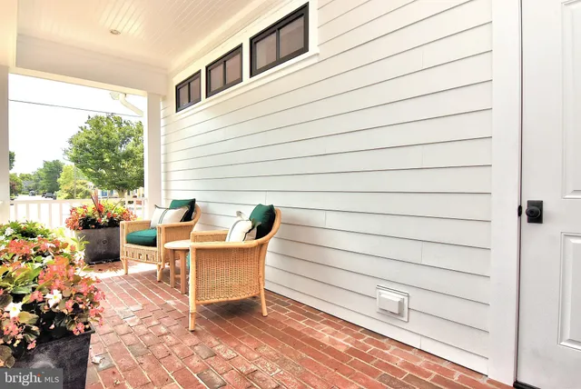 a bedroom with furniture and a flat screen tv