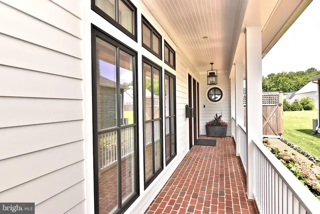 a bathroom with a granite countertop sink mirror and shower