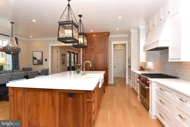 a bathroom with a sink vanity granite toilet and a shower