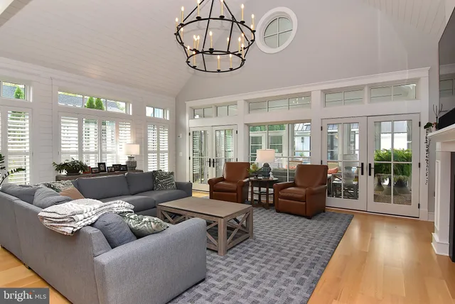 a living room with furniture and large window