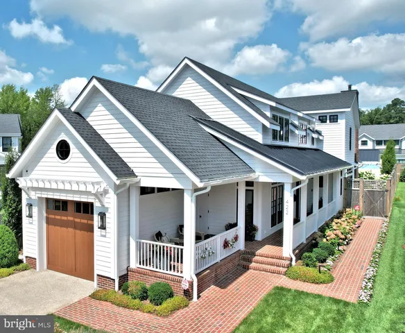a view of a chairs and table in the patio and a fire pit