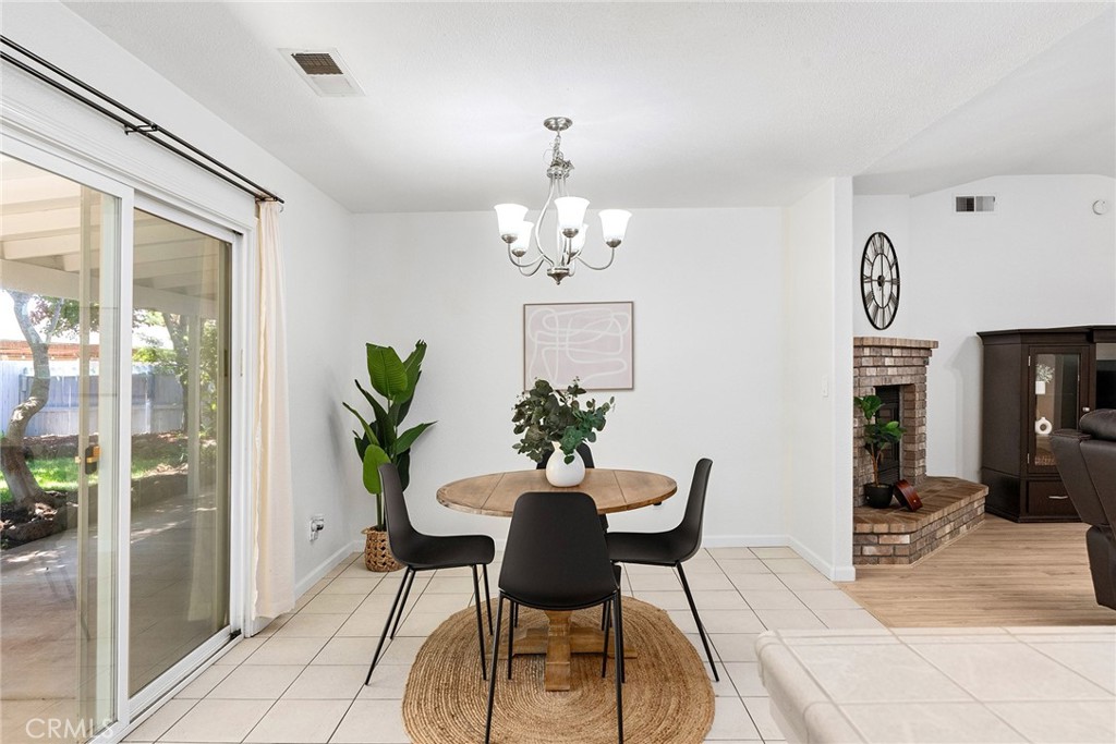 3011 Calistoga Drive Chico, CA 95973 - Photo 11 of 40 a dining room with furniture a livingroom and chandelier
