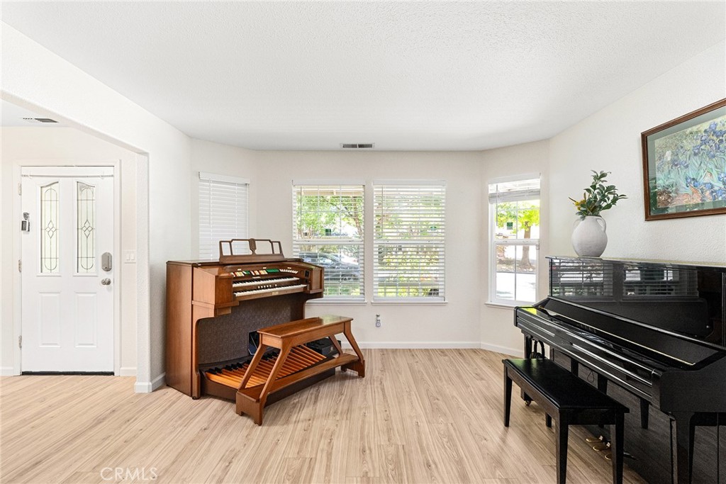 3011 Calistoga Drive Chico, CA 95973 - Photo 16 of 40 a living room with furniture and a wooden floor
