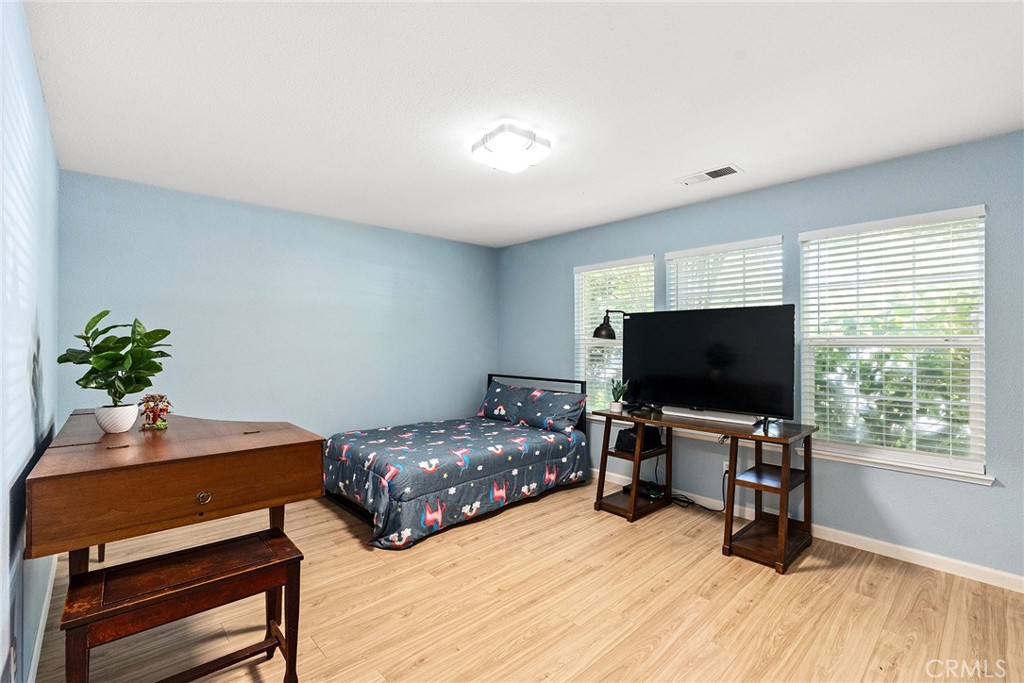 3011 Calistoga Drive Chico, CA 95973 - Photo 23 of 40 a bedroom with furniture and a flat screen tv