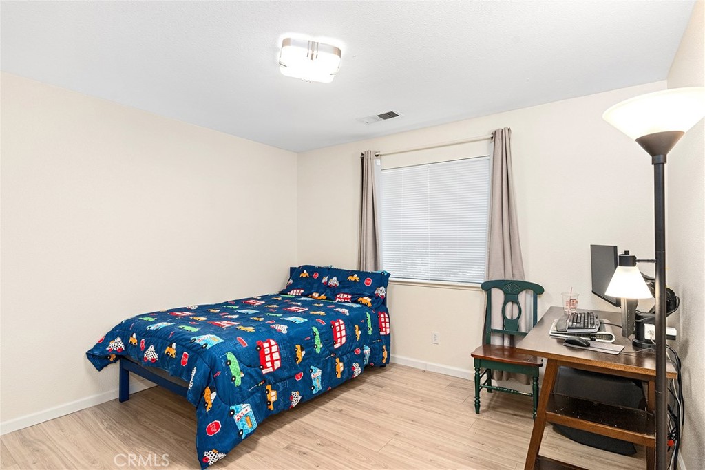 3011 Calistoga Drive Chico, CA 95973 - Photo 25 of 40 a bedroom with a bed table and a window