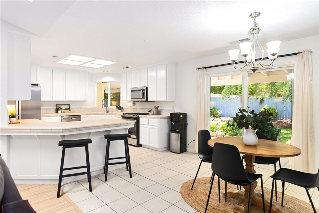 3011 Calistoga Drive Chico, CA 95973 - Photo 3 of 40 a kitchen with a table and chairs in it