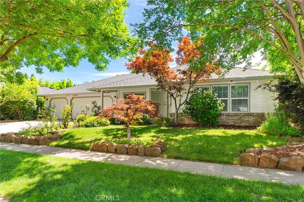 3011 Calistoga Drive Chico, CA 95973 - Photo 6 of 40 a front view of a house with a yard