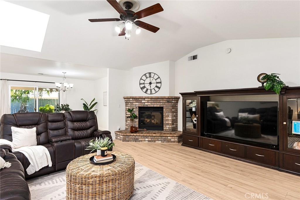 3011 Calistoga Drive Chico, CA 95973 - Photo 9 of 40 a living room with furniture a fireplace and a large window