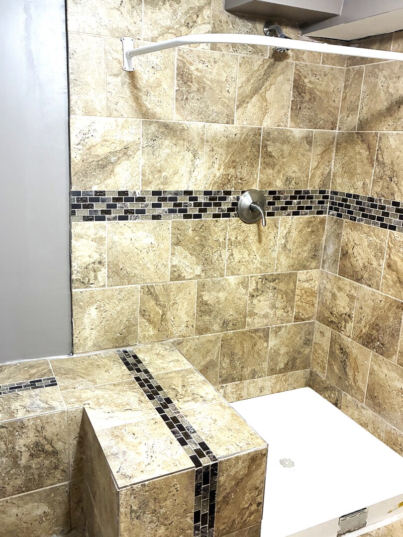 12346 South Indiana Avenue Chicago, IL 60628 - Photo 12 of 14 a bathroom with a granite countertop sink and a bathtub