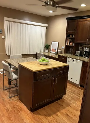 a room with a sink and a bed