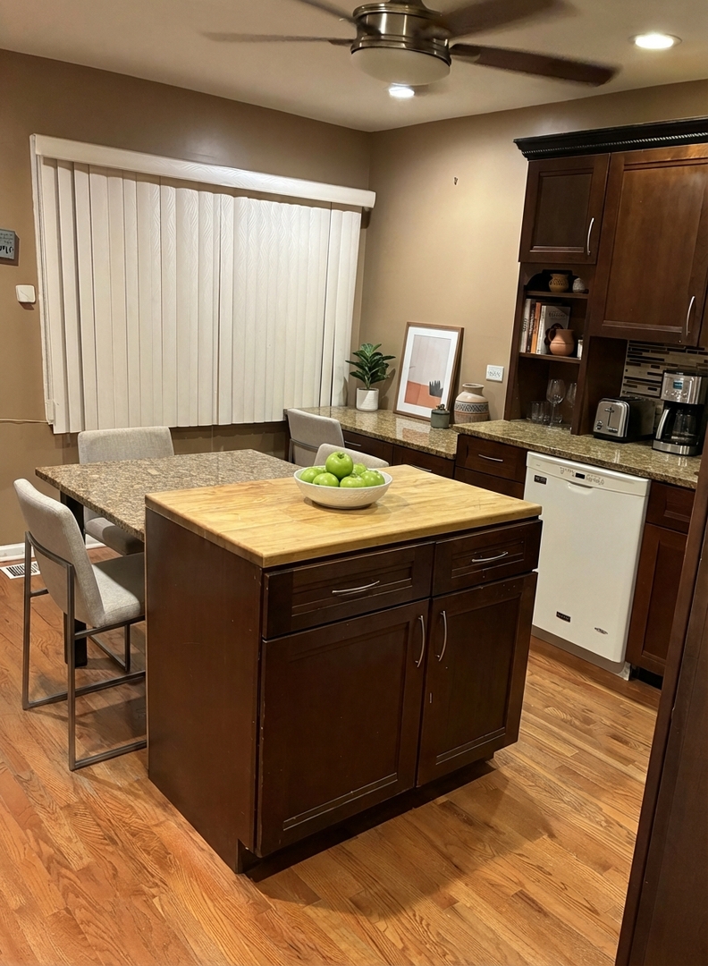 12346 South Indiana Avenue Chicago, IL 60628 - Photo 5 of 14 a room with a sink and a bed