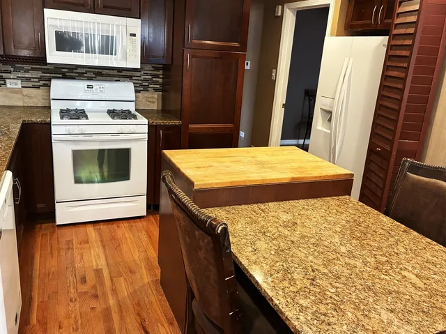 a kitchen with a stove and a microwave