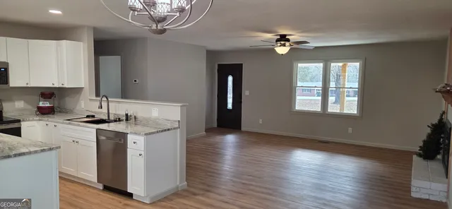 a view of a bathroom from a hallway
