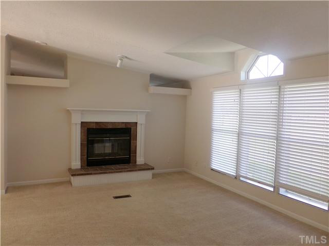 Living room - Beautiful fireplace with tile surround - double sided fireplace other side is in the DEN area. Living Room