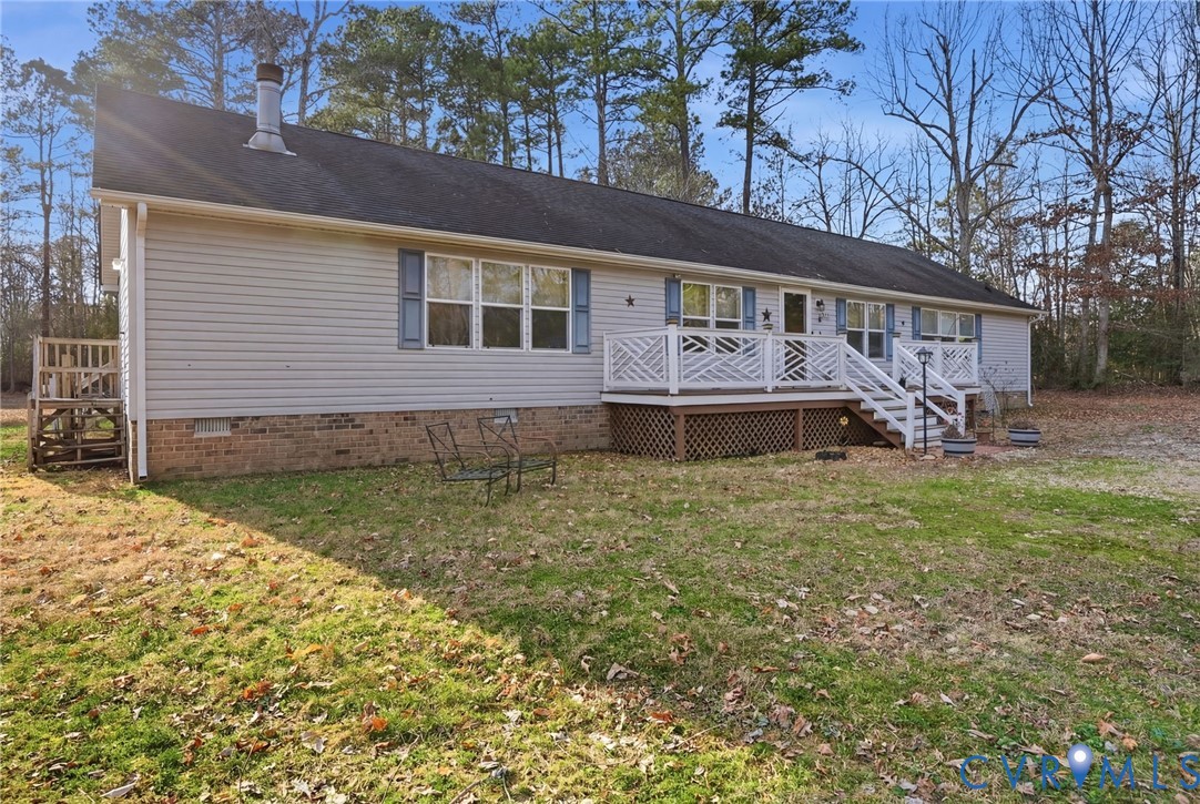 a front view of a house with a garden and yard