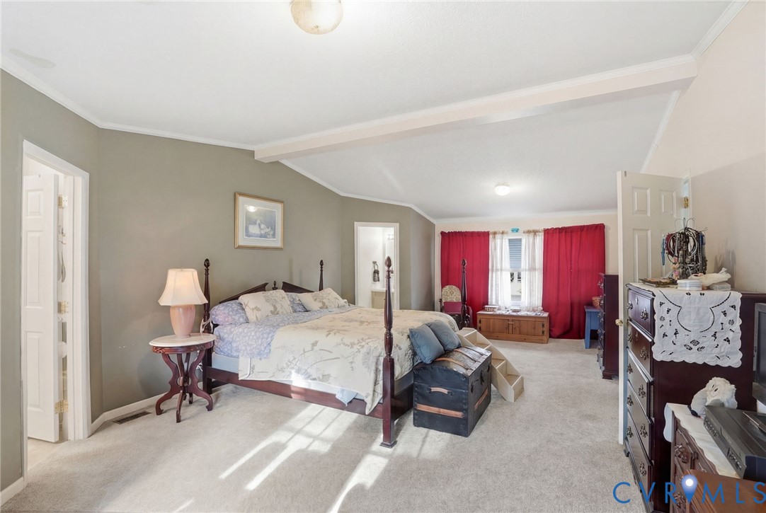 11621 Mapsico Road Charles City, VA 23030 - Photo 17 of 36 a bed room with a bed and furniture