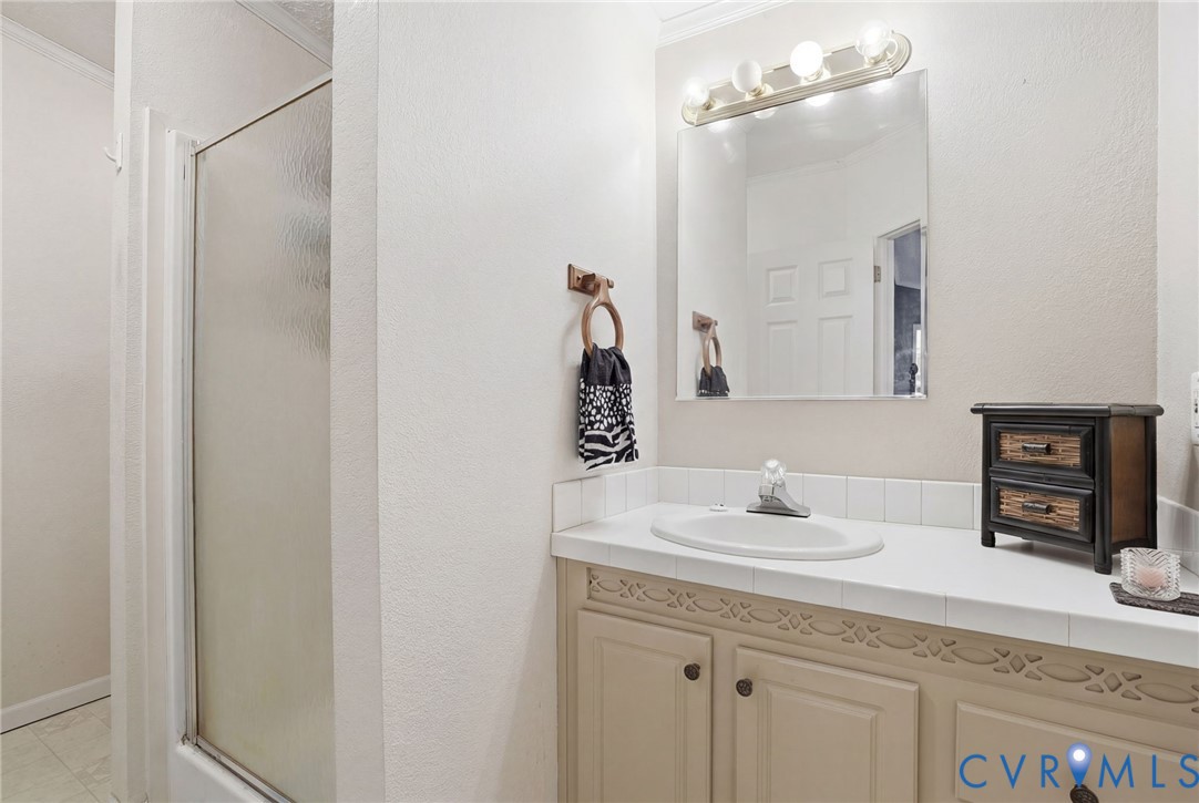 11621 Mapsico Road Charles City, VA 23030 - Photo 20 of 36 a bathroom with a sink and a mirror