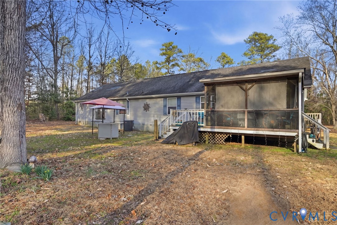 11621 Mapsico Road Charles City, VA 23030 - Photo 30 of 36 a view of a house with a porch and a table