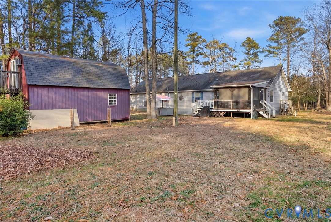 11621 Mapsico Road Charles City, VA 23030 - Photo 31 of 36 a view of a house with a yard and sitting area