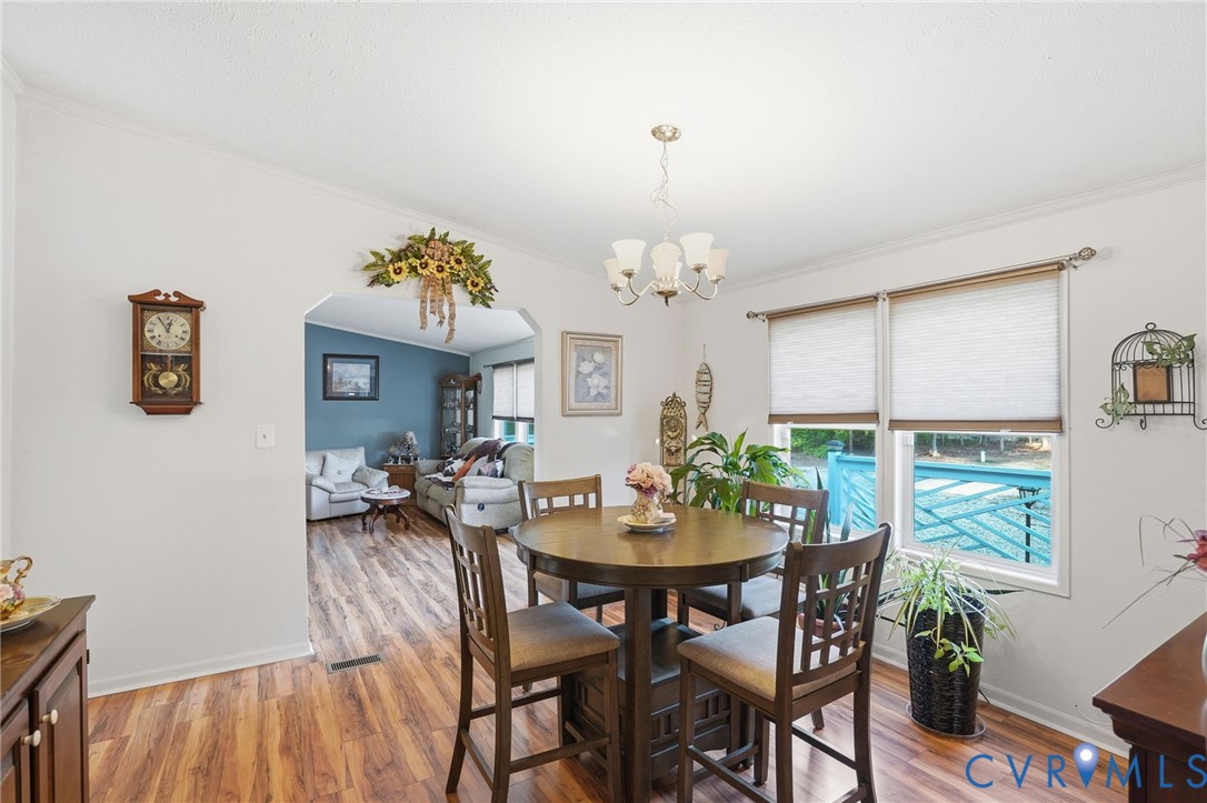 11621 Mapsico Road Charles City, VA 23030 - Photo 6 of 36 a view of a dining room with furniture and chandelier