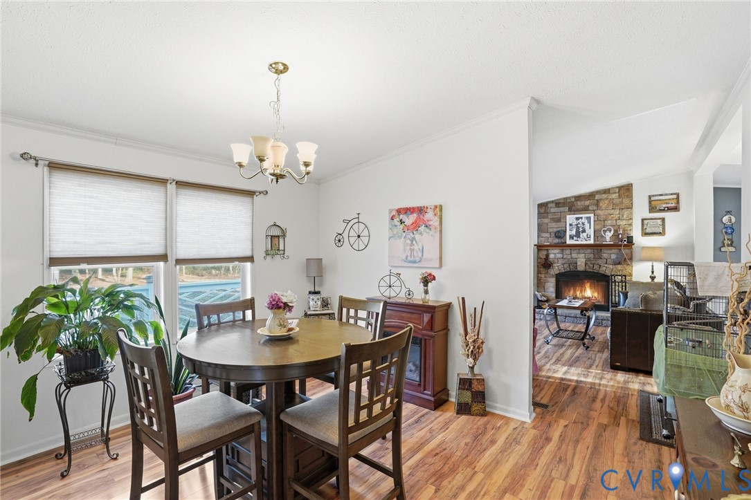 11621 Mapsico Road Charles City, VA 23030 - Photo 7 of 36 a view of a dining room with furniture window and wooden floor