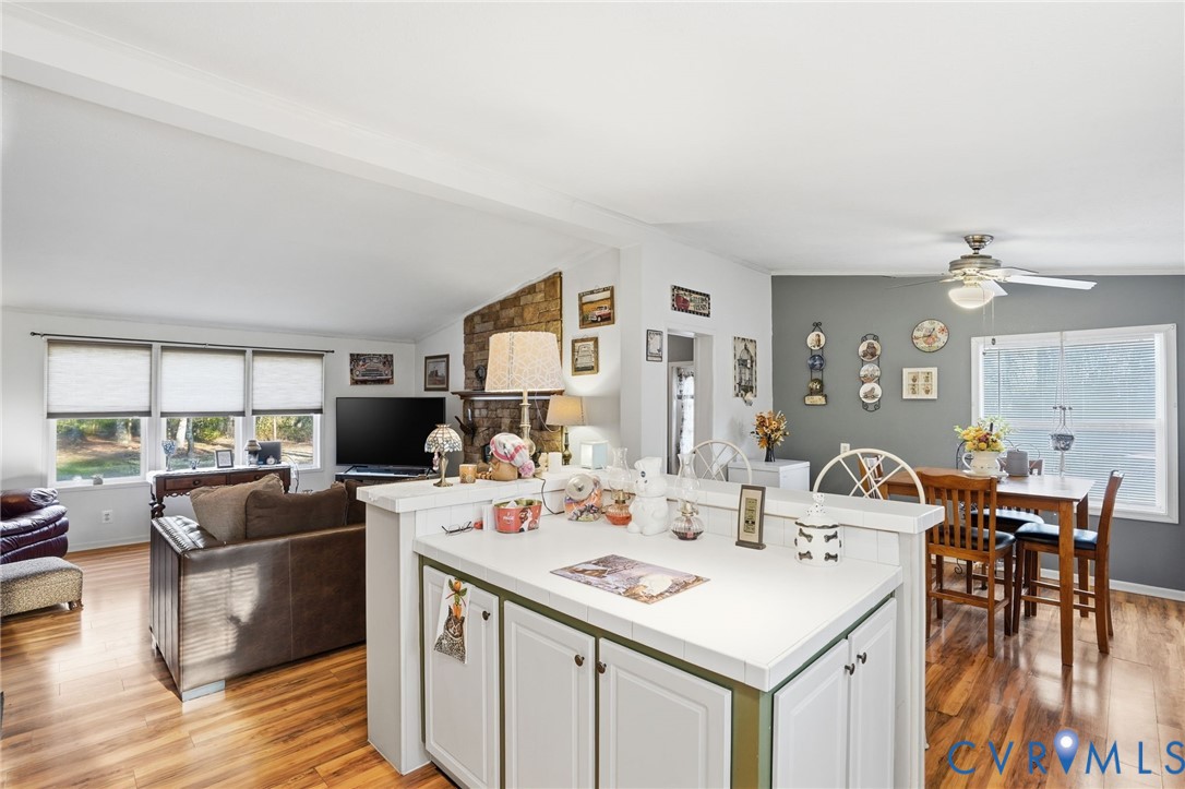 11621 Mapsico Road Charles City, VA 23030 - Photo 8 of 36 a view of a dining room with furniture and wooden floor