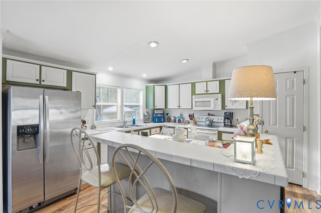 11621 Mapsico Road Charles City, VA 23030 - Photo 10 of 36 a kitchen with appliances a sink and cabinets
