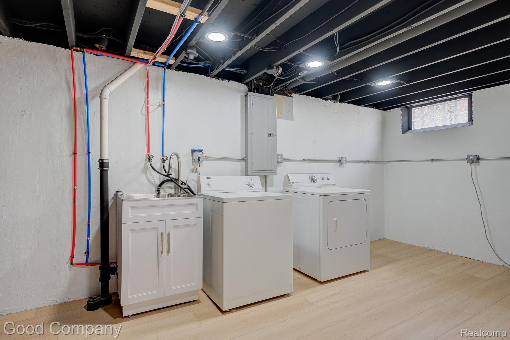 1842 Massoit Road Royal Oak, MI 48073 - Photo 33 of 52 Utility area with light wood-finish flooring and a white vanity sink