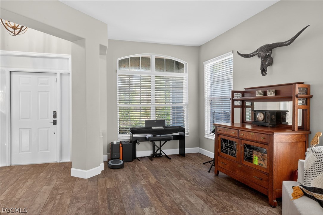 22866 Forest Ridge Drive Estero, FL 33928 - Photo 15 of 38 a view of a livingroom with furniture and a fireplace