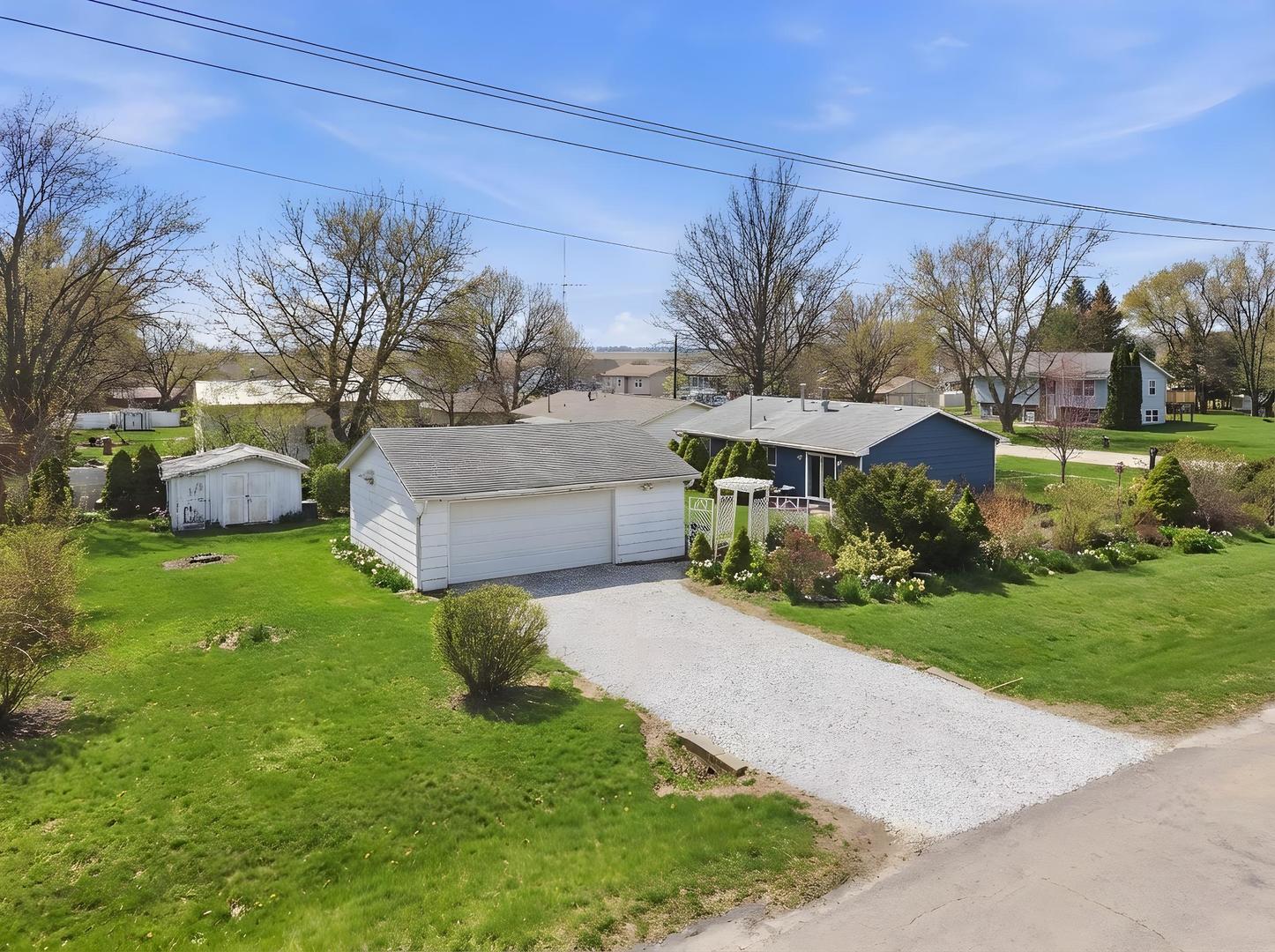 200 Ramona Avenue Rochelle, IL 61068 - Photo 3 of 21 a front view of a house with garden