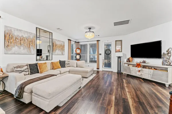 a spacious bathroom with double vanity sinks a large mirror and a shower