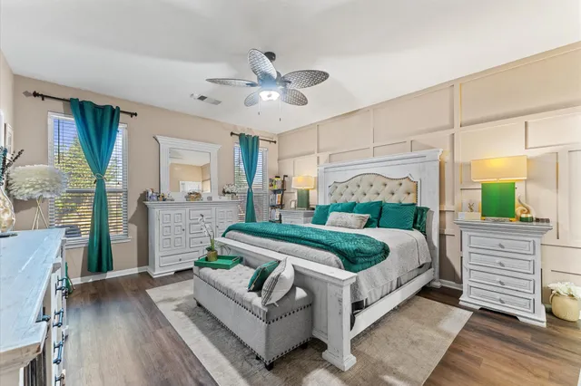 a bed room with a bed and a mirror