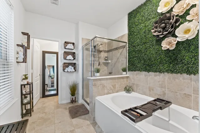 a bathroom with a sink a bathtub and a shower