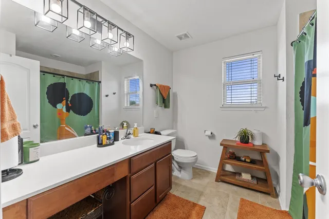 a bathroom with a sink double vanity and a mirror