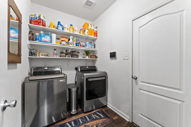 a kitchen with stainless steel appliances granite countertop a refrigerator and a stove
